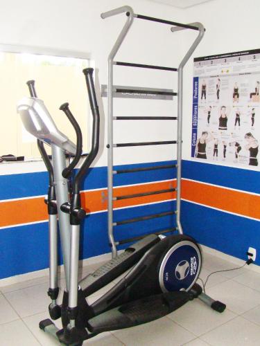 a gym with a treadmill in a room at Larison Economy by Easy Hotéis in Porto Velho