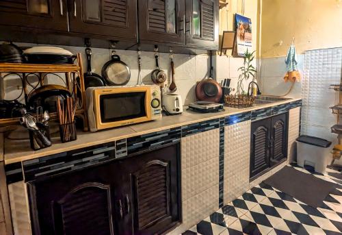 Kuchyň nebo kuchyňský kout v ubytování Non Pakse Hostel