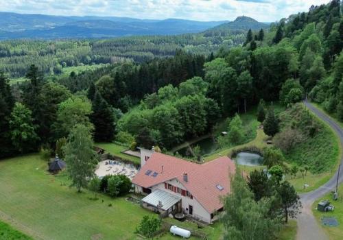an aerial view of a large house in the woods at La Belle Charbonnière in La Grande Fosse