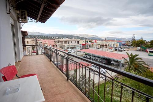 a balcony with a view of a town with a train at Μεζονέτα AIKATERINI N 9 in Chios