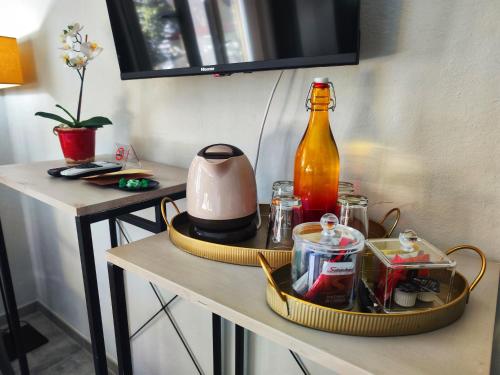 a table with a drink bottle and dishes on it at I Levrieri in Torre del Lago Puccini