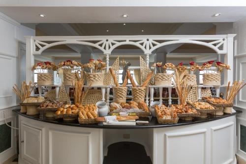 a display of bread and pastries on a table at Eurostars Grand Cayacoa in Santa Bárbara de Samaná