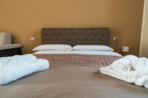 Кровать или кровати в номере Agriturismo MASSERIA QUISISANA