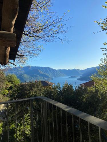 a view of a lake from the balcony of a house at Appartamento del Meo in Perledo