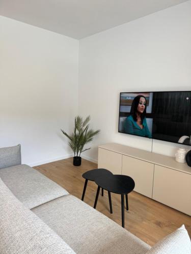 TV a/nebo společenská místnost v ubytování Apartmán s výhľadom na Vysoké Tatry a les
