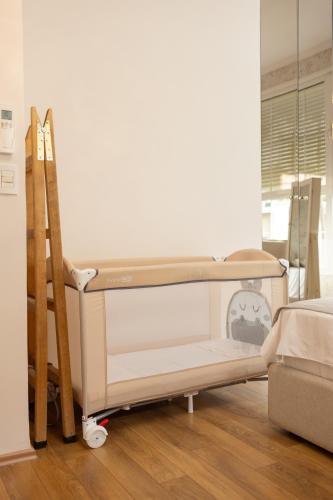 a bunk bed with a ladder in a room at Ingrit Gjoni Villas in Draçi