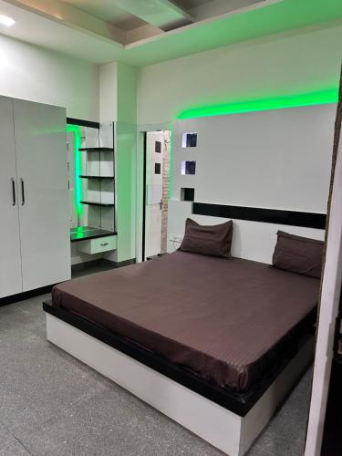 a bedroom with a bed in a room at Hotel Lotus Inn - Hisar in Hisār