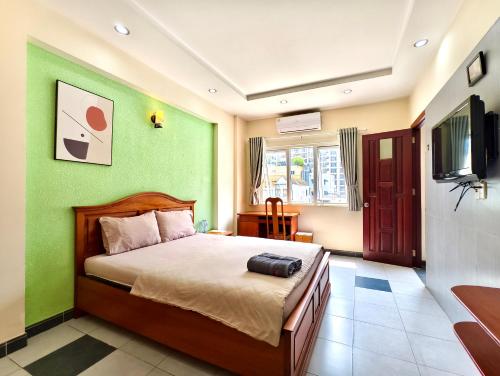 En eller flere senge i et værelse på Sen Vivian Home