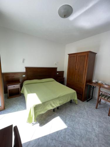 Postel nebo postele na pokoji v ubytování Residence Andrea a mare