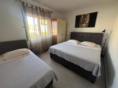 Postel nebo postele na pokoji v ubytování Apartments Iva