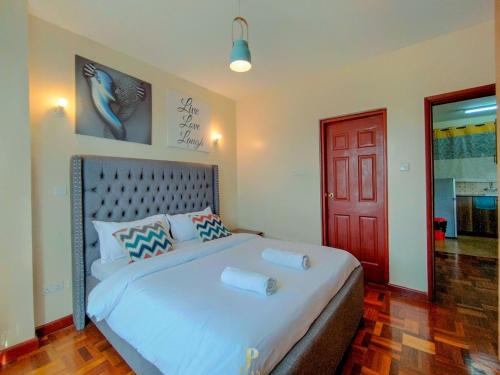 Ένα ή περισσότερα κρεβάτια σε δωμάτιο στο Elite 2 bedroom westlands