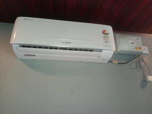 a printer and a video game system on a wall at Shreeram Homestay in Gokarn