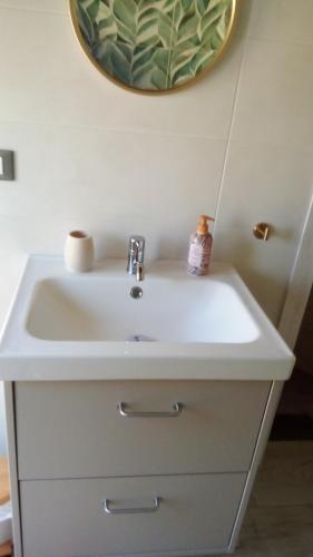 a white sink in a bathroom with a mirror at A Casa di Nene in Rivanazzano