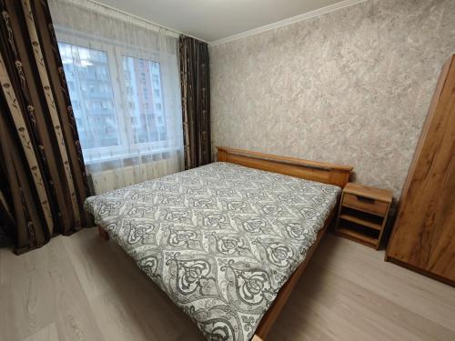 Ένα ή περισσότερα κρεβάτια σε δωμάτιο στο Atmodas street apartaments