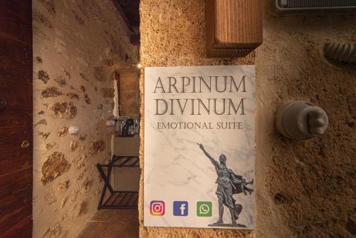 a sign on the wall of a room with an armenium yawnnum anatomical at Arpinum Divinum luxury loft in Arpino