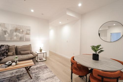 a living room with a couch and a table at Unit 3 1Bed Room with Queen plus Sofa Bed in the Heart of DC in Washington, D.C.