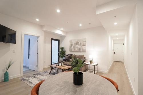 a living room with a table and a couch at Unit 3 1Bed Room with Queen plus Sofa Bed in the Heart of DC in Washington, D.C.