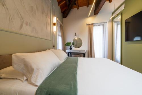 Postel nebo postele na pokoji v ubytování La Merope Guest House de Charme
