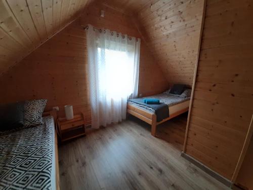 Postel nebo postele na pokoji v ubytování Czarcie Chatki