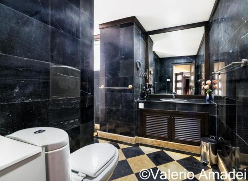 a bathroom with a toilet and a sink at Waterfront Karon Beach by PHR in Karon Beach