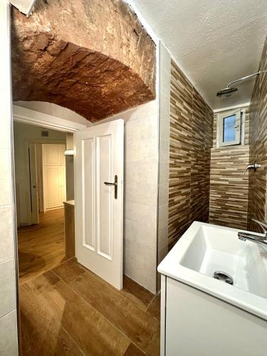 a bathroom with a sink and a white counter top at Portobello In Centro in Salerno