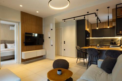a living room with a couch and a kitchen at Casa De Afrodite in Argostoli