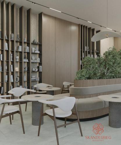 a restaurant with tables and chairs in a room at Hotel Skanderbeg in Golem