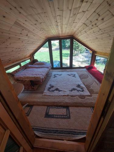an overhead view of a room with two beds in a cabin at Beco's Place in Plav