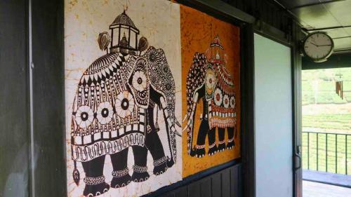 a wall with a painting of a person riding a horse at The ZenDen in Lindula