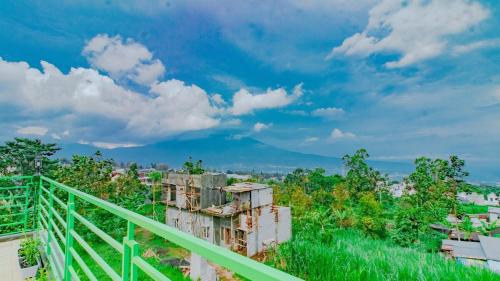a view of a city with a mountain in the background at Villa Panderman Asri with Private Pool and Rooftop in Tlekung