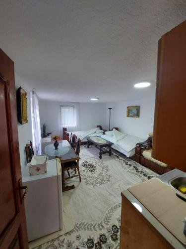 a living room with a couch and a table at Downtown Apartment in Plav
