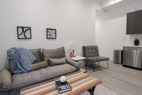 a living room with a couch and a table at Unit 5 Cozy 1 Bed Room with Queen Bed plus Sofa Pullout in Washington, D.C.