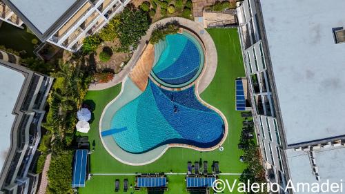 an overhead view of a swimming pool in a building at KB Apartments Karon Beach by PHR in Karon Beach