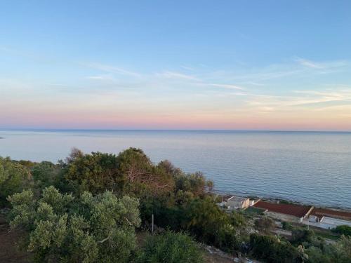 a view of the ocean at sunset at Villa thomas torre vado san Gregorio in Marina San Gregorio