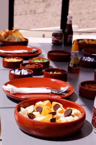 a table topped with plates of food on a table at Wadina resort Wadi Bani Khalid in Muqal