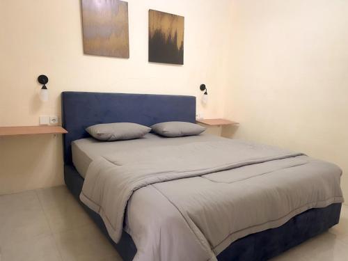 Ένα ή περισσότερα κρεβάτια σε δωμάτιο στο Aysee Homestay Syariah