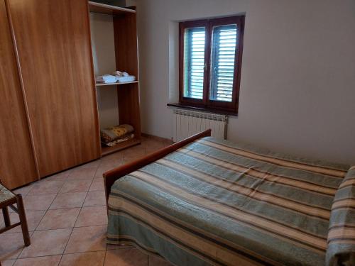 Ένα ή περισσότερα κρεβάτια σε δωμάτιο στο Agriturismo Roccamaia