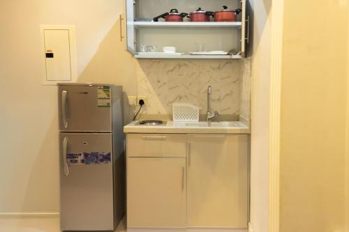 Η κουζίνα ή μικρή κουζίνα στο Areen Al Naeem Served Apartments