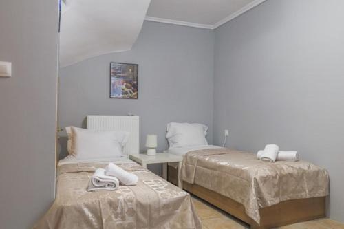 Ένα ή περισσότερα κρεβάτια σε δωμάτιο στο SeaView House Nikiti 2