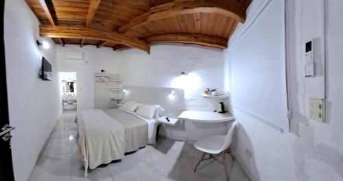 Ένα ή περισσότερα κρεβάτια σε δωμάτιο στο Ex Hostal del Parque
