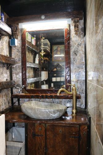 a bathroom with a sink and a mirror at Frenkcottage 5 KM FROM THE AIRPORT- FREE TRANSPORTATION TO THE AIRPORT in Šenčur