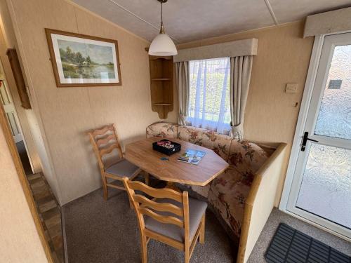 Χώρος καθιστικού στο Happy Days Holiday Home Whithorn2