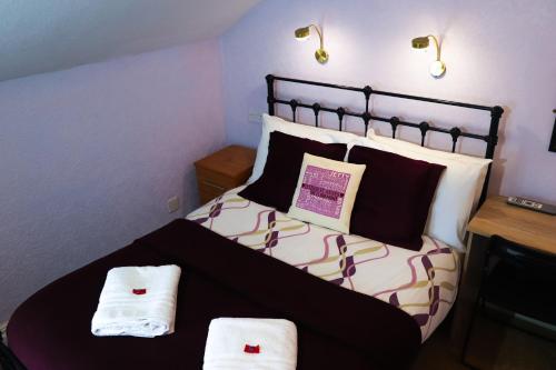 Ein Bett oder Betten in einem Zimmer der Unterkunft The Claremont