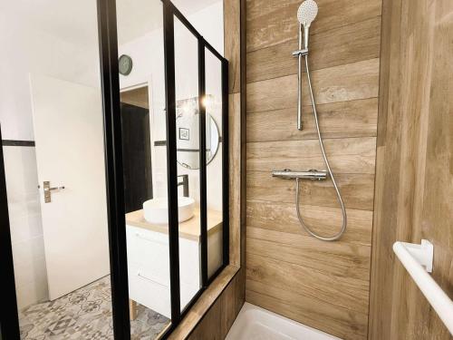 a bathroom with a shower and a sink at Bénodet : Superbe T2 rénové à 100m de la plage, parking inclus - FR-1-481-90 in Bénodet