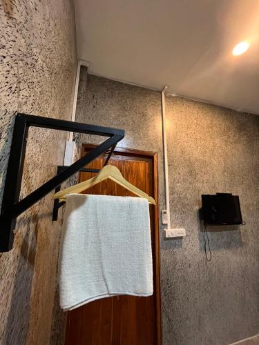 Ένα ή περισσότερα κρεβάτια σε δωμάτιο στο บ้านกลางสวน รีสอร์ต ทุ่งเสลี่ยม สุโขทัย
