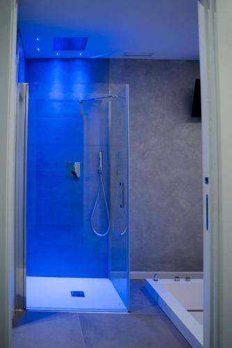 a shower with a glass door in a bathroom at Diamond luxury house in Monopoli
