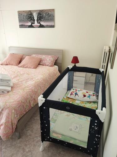 Katil atau katil-katil dalam bilik di Valmontone Central Apartment