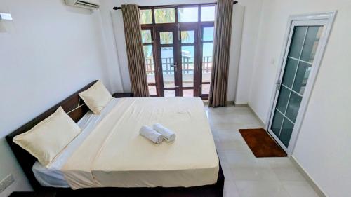 Postel nebo postele na pokoji v ubytování Dutch Villa - Trincomalee