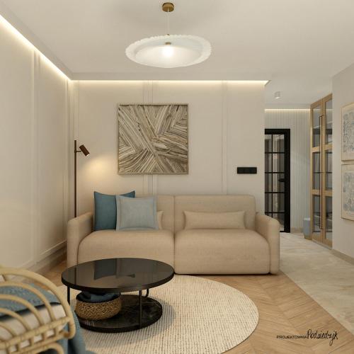 a living room with a couch and a table at Modern Gdańsk Wyspa Sobieszewska in Gdańsk