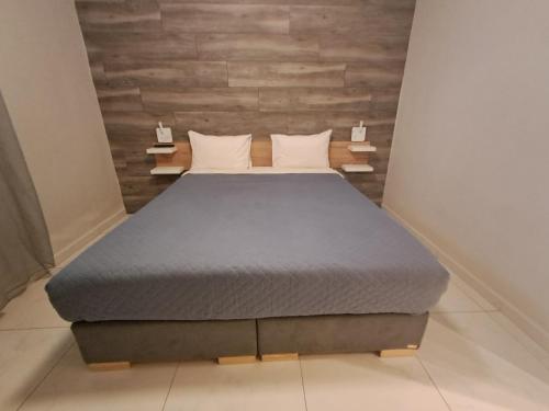 a bedroom with a bed in a room at Blue View Apartments in Kavala